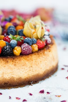 Closeup of delicious sponge cake topped with fresh berries