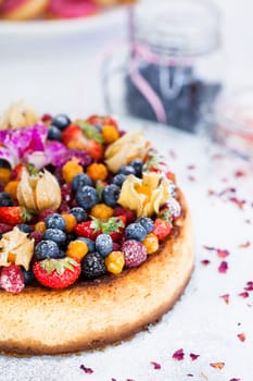 Closeup of delicious sponge cake topped with fresh berries
