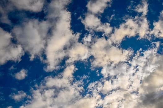 Cloudscape, Colored Clouds at Sunset near the Ocean