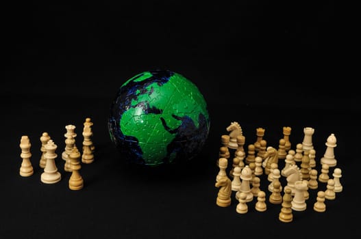Globe And White Chess on a Black Background
