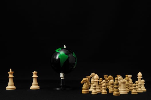 Globe And White Chess on a Black Background