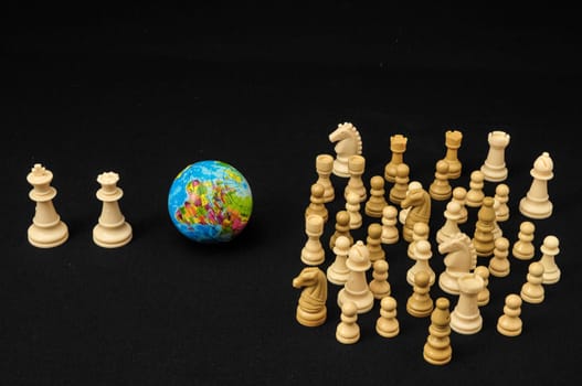 Globe And White Chess on a Black Background