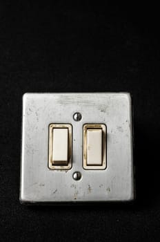Light switch, old-style on a Black Background