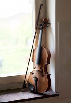 Violin beside window light close up shoot