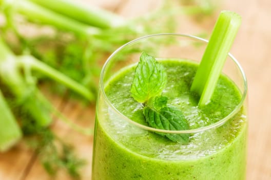 Green smoothie with mint and stick celery