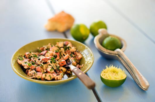 Fresh octopus salad with garlic, parsley, lime and olive oil