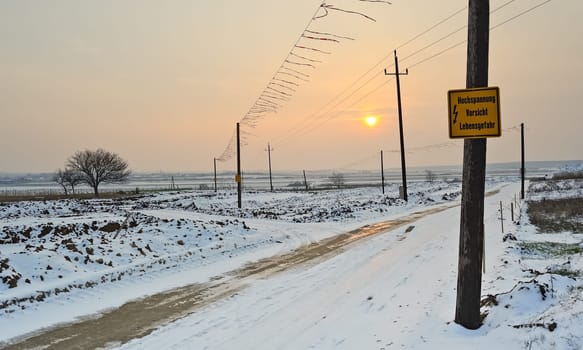 Gravel road at construction site in winter