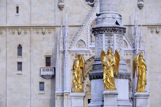 Golden statues in front of the cathedral in Zagreb