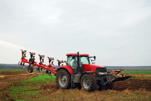 Red tractor me big plough