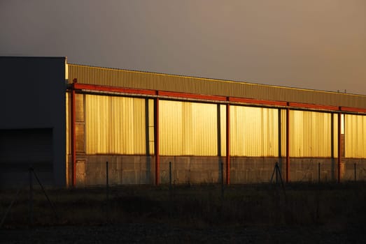 Hall of a factory with golden gates