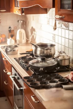 Closeup photo of metal saucepan boiling on stove