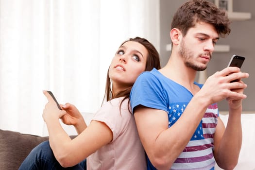 couple problems in which the woman can't speak to the man because he's texting with his mobile phone and ignores the girl