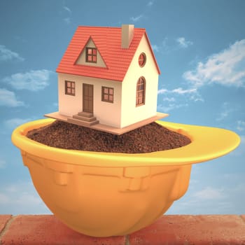 House over the earth inside the hardhat. Concept of construction and protection. Clipping path included.