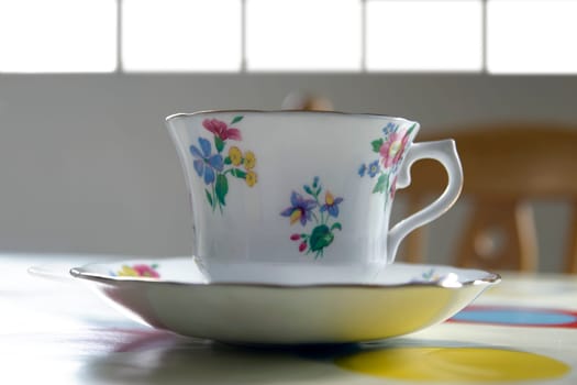 an old fashioned tea cup on a restaurant table