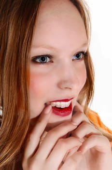 A closeup face picture of a lovely teenager with blue eye's and long blond.hair, isolated for white background..