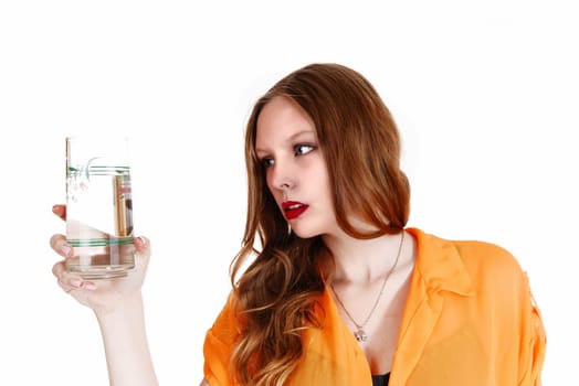 A young lovely woman in a yellow blouse holding a glass of water,.isolated for white background..