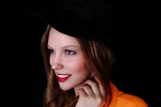 A profile portrait picture of a teenage girl wearing a black hat, .isolated for black background..