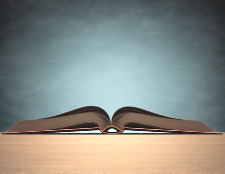 Open book over the table with blackboard on background. Clipping path included.