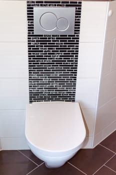 Wall-mounted toilet in white in a modern bathroom.                    Wall hung WC in