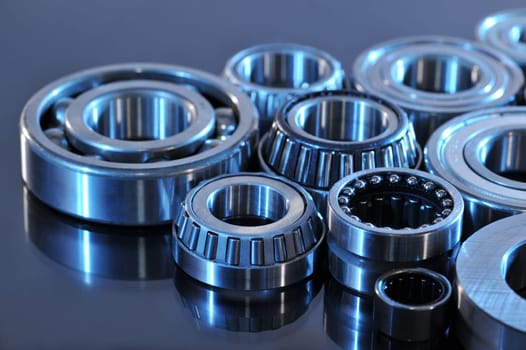 Close-up of various ball bearings in blue light