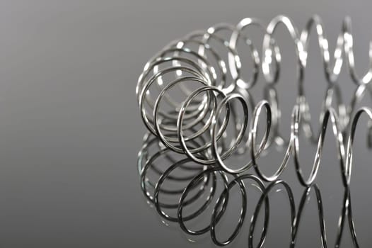 Chrome spiral bent on black background