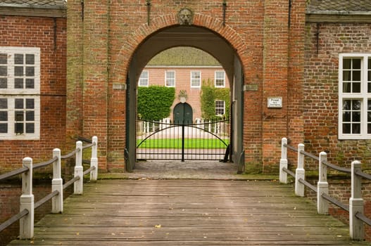 Bridge with entrance gate of Luetetzburg Castle in East Frisia / Germany