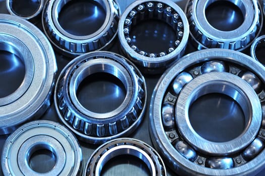 Close-up of various ball bearings in blue light