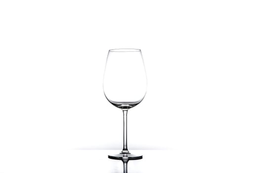 Empty wine glass isolated on white seamless background