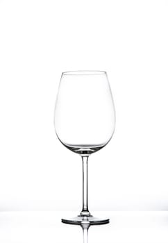 Empty wine glass isolated on white seamless background