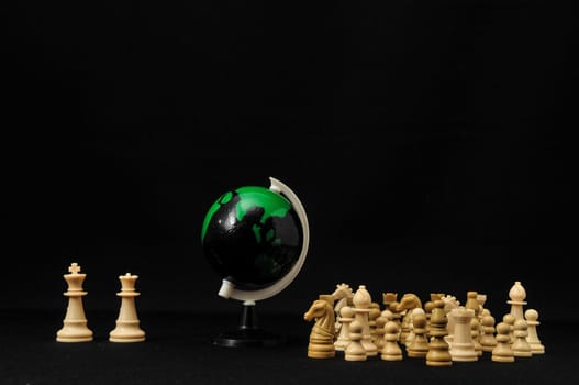 Globe And White Chess on a Black Background