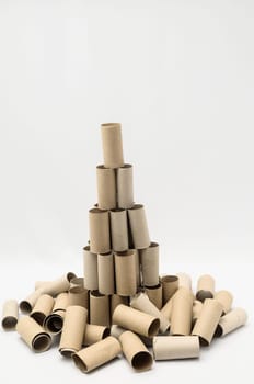 Empty Toilet Rolls Stack Up On a Black Background