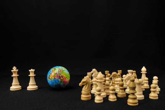 Globe And White Chess on a Black Background