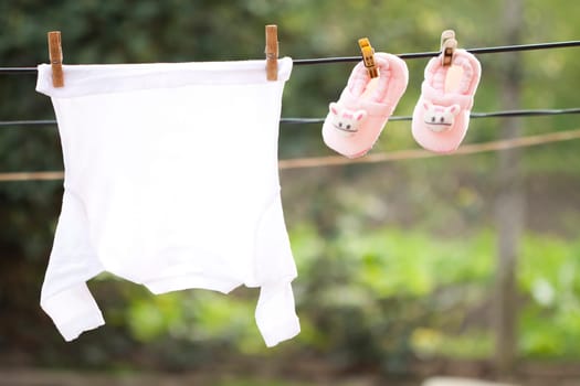 Small Baby clothes hanging on the clothesline