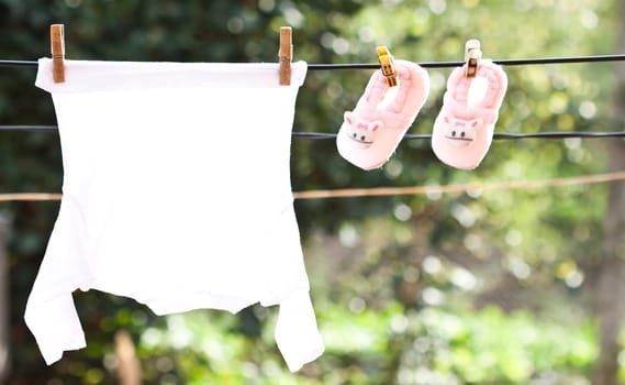 Small Baby clothes hanging on the clothesline