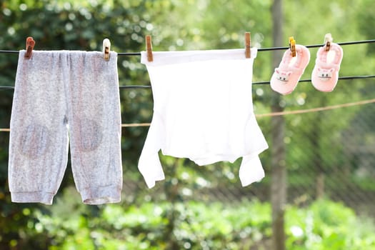 Small Baby clothes hanging on the clothesline