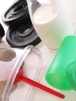 Fitness background with sports equipment and weight gainer