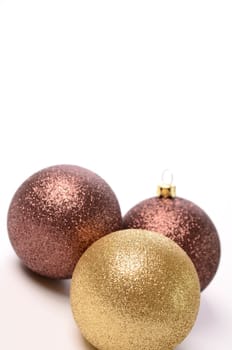 Christmas baubles on a white background with space for text