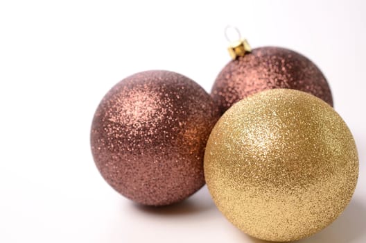 Christmas baubles on a white background with space for text