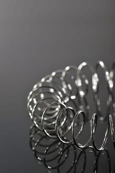 Chrome spiral bent on black background