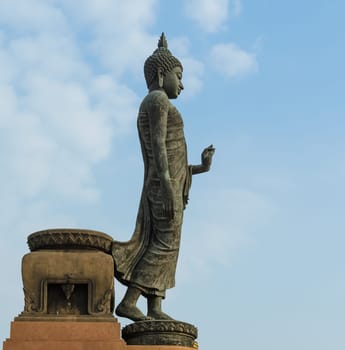 Walking Buddha statue at Phutthamonthon in Nakorn Pathom, Thailand