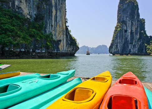 Colourful kayaks with limestone mountains background