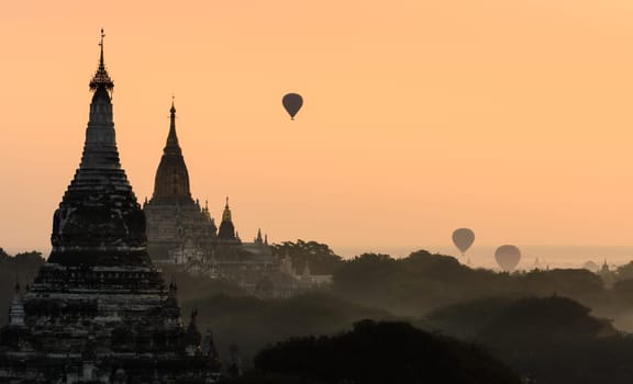 Beautiful view of Bagan pagoda at sunrise with hot air balloon, Myanmar