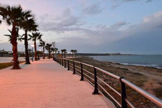 Stone beach promenade at sunset on Costa Blanca Spain