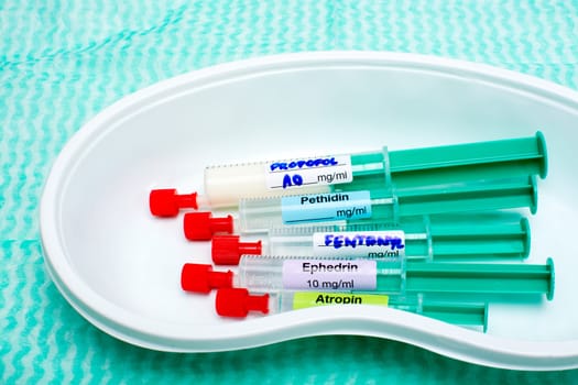 Anaesthetic induction syringes in a kidney dish