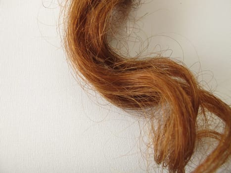 Maroon strands of hair