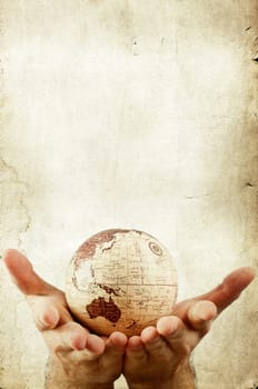 Planet earth in human hands