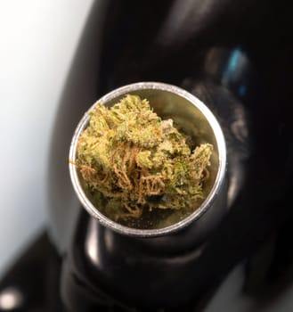 Broken Green Buds sitting in the bowl before a smoke