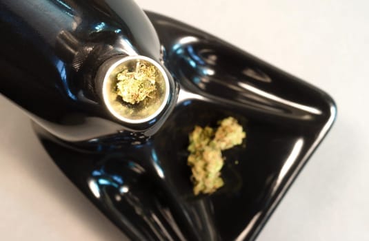 Broken Green Buds sitting in the bowl before a smoke