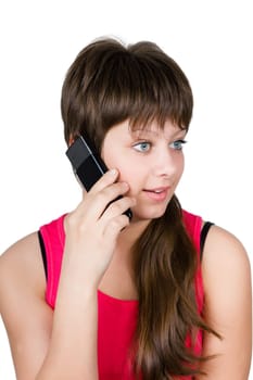 beautiful young girl talking on a cell phone. isolated on white background
