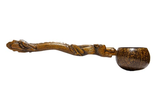 the Coconut shell dipper with dragon handle on white background